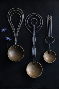 Three spoons, rippled and reflected by Erica Moody